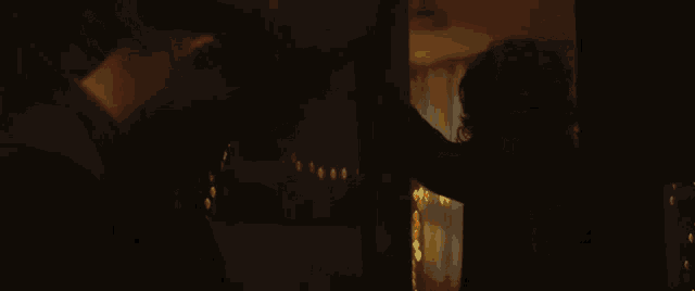 a man standing in front of a mirror looking at himself