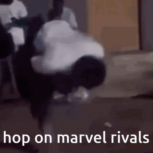 a man is doing a handstand in a room with the words `` hop on marvel rivals '' written on the bottom .