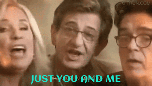 two men and a woman singing with the words just you and me