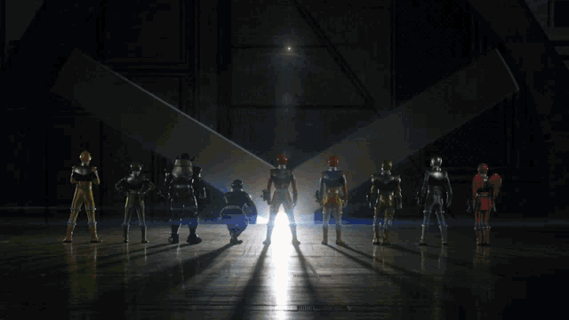 a group of superhero figures are standing in a dark room
