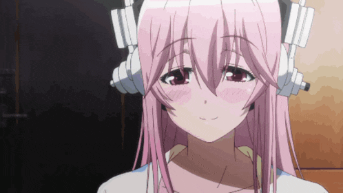 a girl with pink hair is wearing headphones and smiling