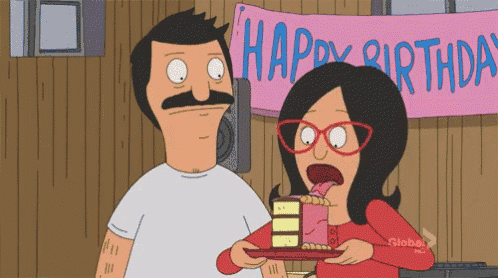 a man and a woman are eating a birthday cake in front of a happy birthday banner
