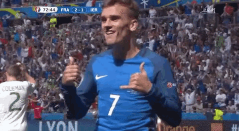 a soccer player wearing a number 7 jersey is giving a thumbs up .