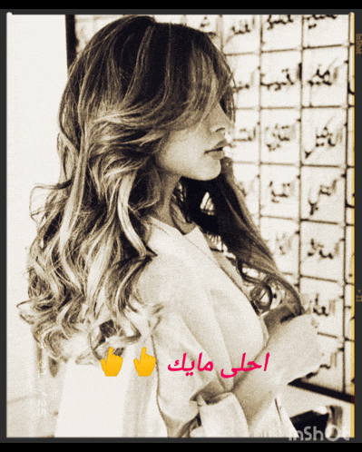 a black and white photo of a woman with arabic writing around her
