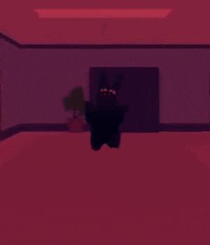 a black robot is standing in a room with red walls and a purple door .