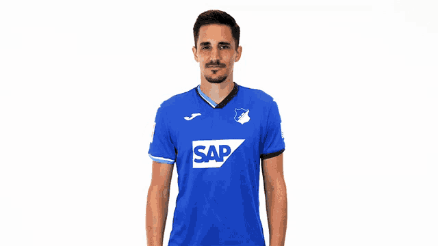 a man in a blue shirt with the word sap on the front