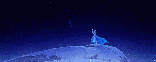 a woman in a blue dress is standing on top of a snow covered globe surrounded by blue lights .