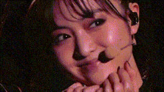 a close up of a woman 's face with a mustache on it