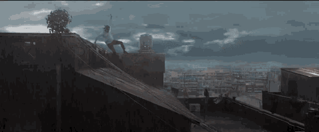 a man is sitting on the roof of a building holding a sword