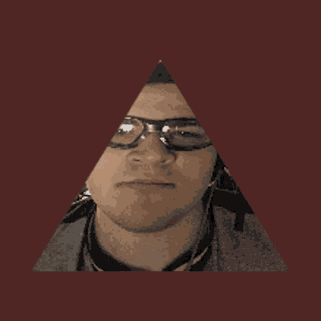 a pyramid with a man 's face in it