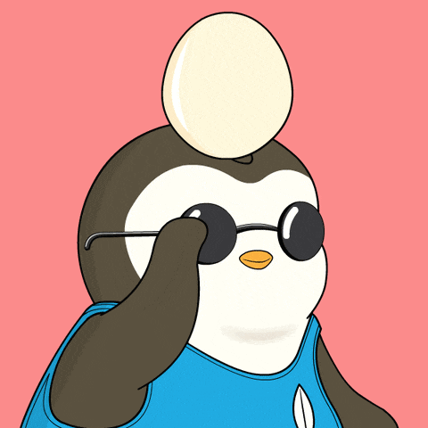 a penguin wearing glasses and a blue shirt has an egg on top of its head