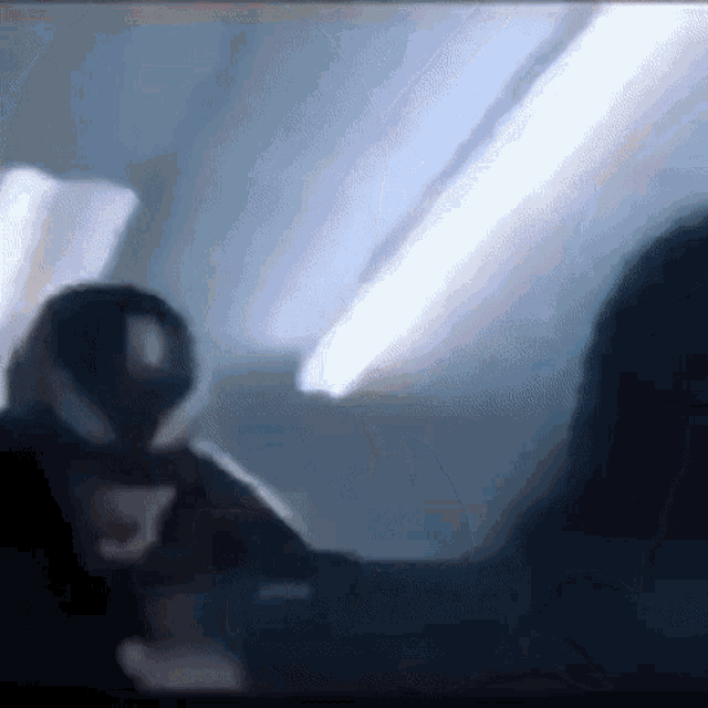 a man in a spiderman costume is standing next to a woman in a spiderman costume on a plane .