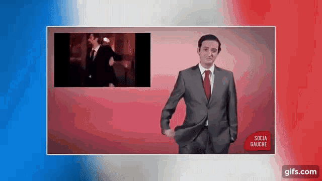 a man in a suit and tie is standing in front of a red , blue and white background .