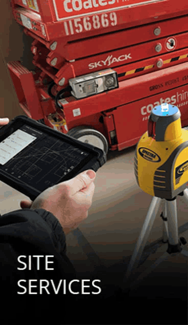 a person holding a tablet in front of a skyjack lift