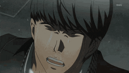 a close up of a man 's face with tears coming out of it