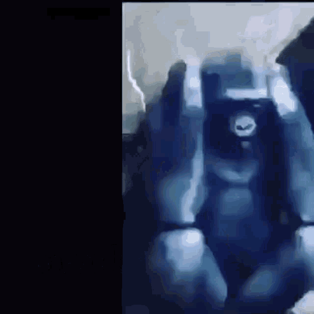 a close up of a blue robot with a skull on its head .