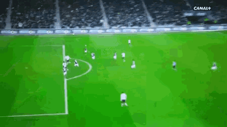 a soccer game is being played on a channel + television