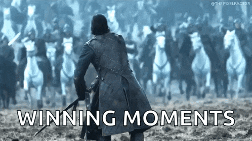 a man is riding a horse with a sword in his hand in front of a row of horses .