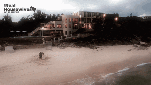 a poster for real housewives shows a large house on the shore