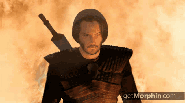 a man holding a sword in front of a fire with the website getmorphin.com below him