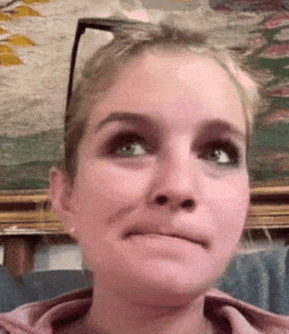 a close up of a woman making a funny face