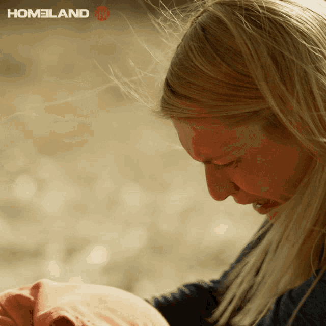 a woman is crying in front of a homeland tv ad