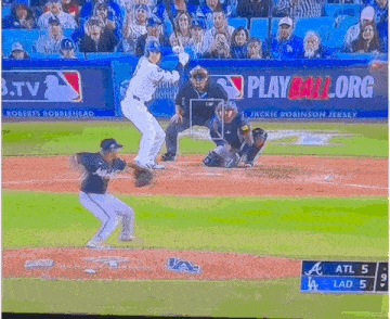 a baseball game is being played in front of a play ball org banner