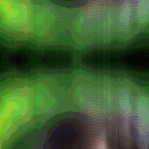 a green background with a few spots of light