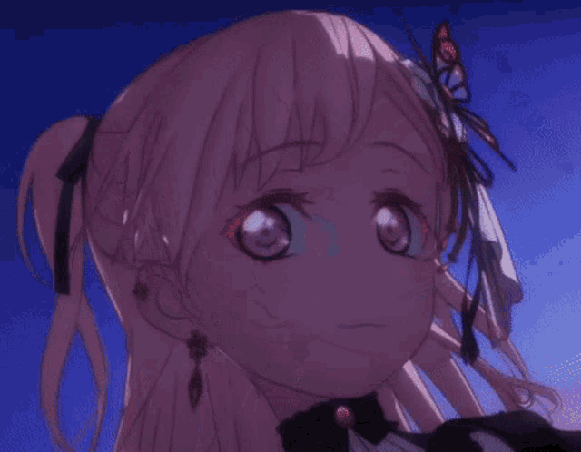a close up of a girl 's face with pink hair and purple eyes