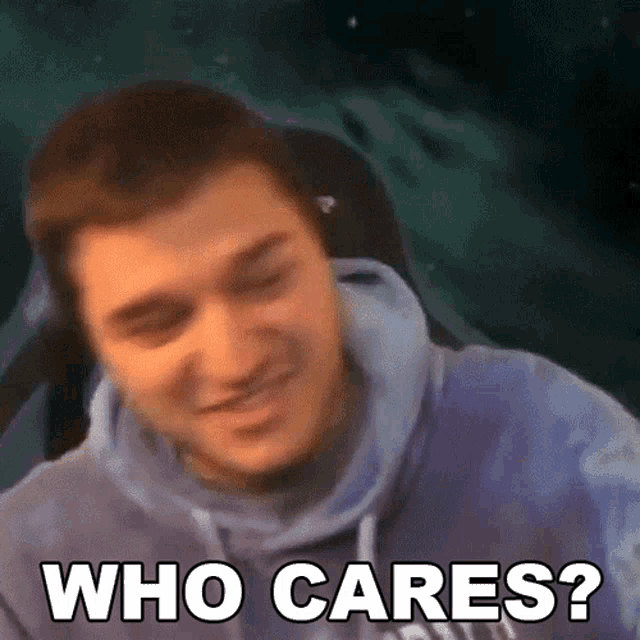 a man in a blue hoodie is making a funny face and says who cares ?