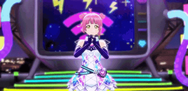 a girl in a purple dress is standing on a stage in front of a television .