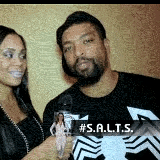 a man wearing a black shirt that says #s.a.l.t.s.