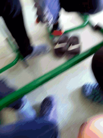 a blurry picture of a person standing in front of a mirror with a green frame