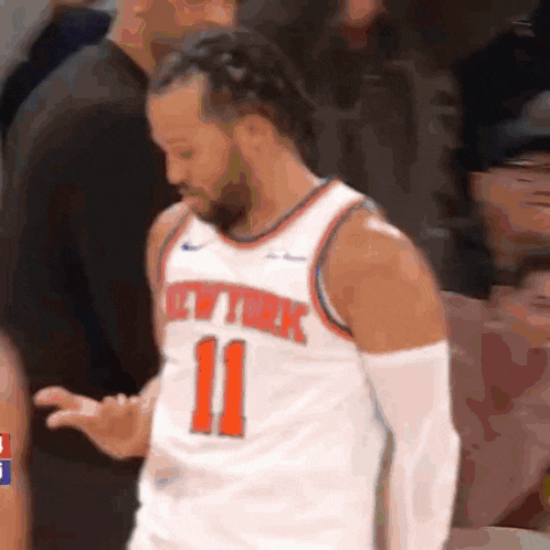 a basketball player wearing a new york jersey with the number 11 on it