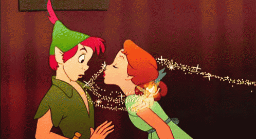 peter pan and wendy are kissing with sparkles coming out of their mouths
