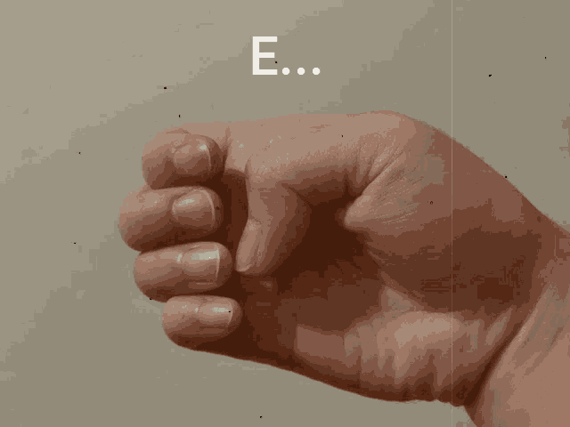 a close up of a person 's hand pointing with the word ehhhh on the bottom