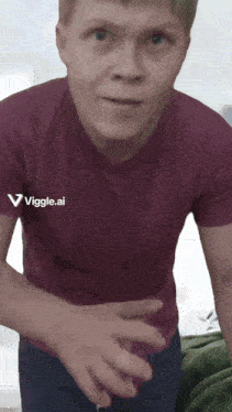 a man wearing a burgundy shirt with a viggle.ai sticker on his sleeve
