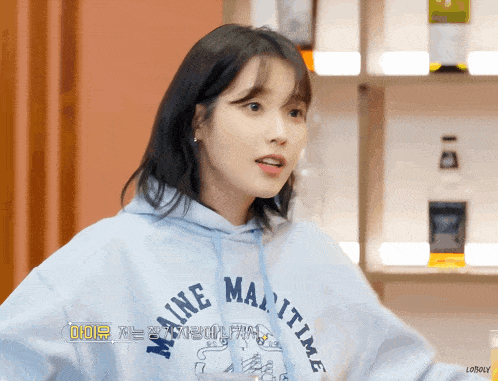 a woman wearing a maine maritime hoodie