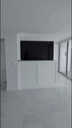 a flat screen tv is sitting on a white cabinet