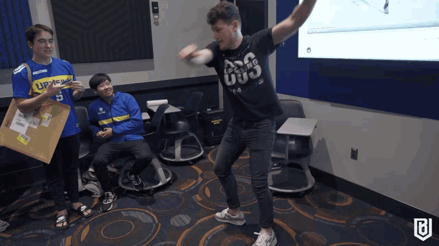 a man wearing a shirt that says ' ep gaming 003 ' on it
