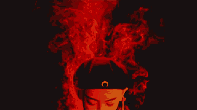a man wearing a black hat with a crescent moon on it
