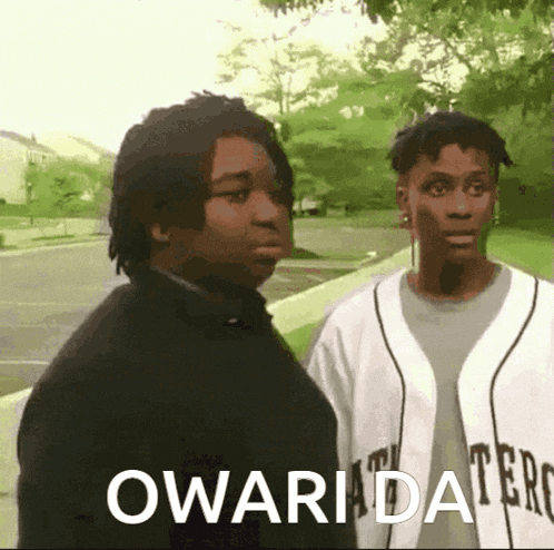 two men are standing next to each other with the word owarida on the bottom right