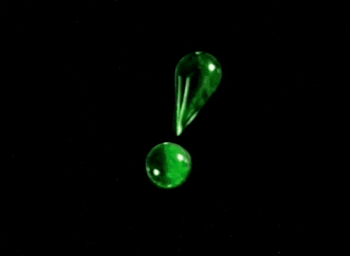 a green exclamation point is floating in the air on a black background