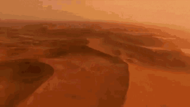 the word queen is written on a desert landscape