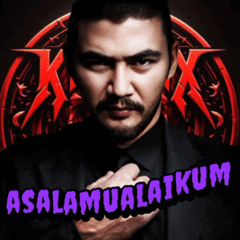 a man in a black suit stands in front of a sign that says asalamualaikum