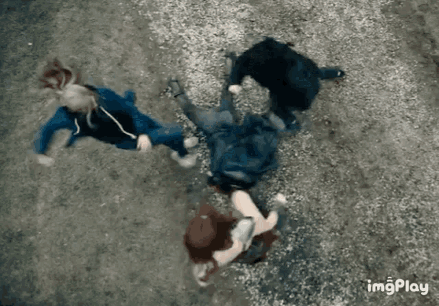 a group of people laying on the ground with a gif that says imgplay on the bottom