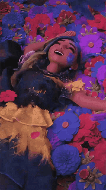 a doll is laying in a bed of flowers with her eyes closed