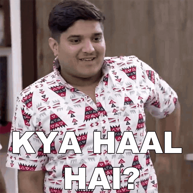 a man wearing a shirt that says " kya haal hai " on it