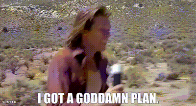 a woman in a hat is holding a microphone and saying `` i got a goddamn plan . ''