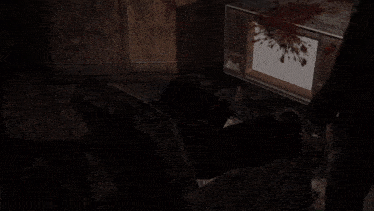 a man in a suit stands in front of a television with blood on it and says " oh my god who could ve "